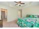 Bright bedroom features a ceiling fan, carpet and windows with vibrant coverings at 412 Stone Flower Ln, Raleigh, NC 27603