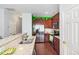 Kitchen with granite countertops, stainless steel appliances, a large island and colorful wall accents at 412 Stone Flower Ln, Raleigh, NC 27603