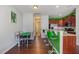 Bright kitchen features a dining nook, bar counter, wooden cabinets and stainless steel appliances at 412 Stone Flower Ln, Raleigh, NC 27603
