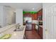Well-lit kitchen with stainless steel appliances, granite countertops, and dark wood cabinets at 412 Stone Flower Ln, Raleigh, NC 27603