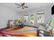 Cozy living room with a ceiling fan, leather furniture, and a colorful area rug at 412 Stone Flower Ln, Raleigh, NC 27603