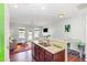 Bright, open-concept living area with granite countertops, stainless steel appliances, and lots of natural light at 412 Stone Flower Ln, Raleigh, NC 27603