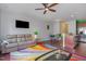 Open-concept living area with bar seating, leather furniture, and hardwood floors at 412 Stone Flower Ln, Raleigh, NC 27603