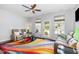 A bright living room with a colorful rug, ceiling fan and natural light at 412 Stone Flower Ln, Raleigh, NC 27603