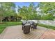 Backyard lounge area on a wooden deck surrounded by lush green trees at 45 Mill Cir, Clayton, NC 27527
