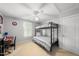 Cozy bedroom with a black metal bunk bed, desk and comfortable furniture at 45 Mill Cir, Clayton, NC 27527