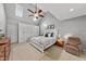 Serene bedroom with vaulted ceilings, a ceiling fan, plush carpet, and ample natural light at 45 Mill Cir, Clayton, NC 27527