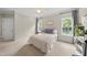 Comfortable bedroom with soft carpet, natural light from two windows, neutral paint, and a calming aesthetic at 45 Mill Cir, Clayton, NC 27527
