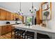 Bright kitchen with white countertops, stainless steel appliances, ample cabinet space, and a breakfast bar at 45 Mill Cir, Clayton, NC 27527