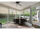 The sunroom features a dining set with views of the green outdoors at 45 Mill Cir, Clayton, NC 27527