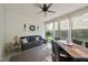 Inviting sunroom with a comfortable seating area, dining set, and a view of the backyard at 45 Mill Cir, Clayton, NC 27527