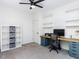 Spacious bedroom with desk and shelving, perfect for a home office or study space at 4521 Briarglen Ln, Holly Springs, NC 27540