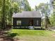 Charming home with a well-manicured lawn and a lovely exterior, surrounded by mature trees at 4521 Briarglen Ln, Holly Springs, NC 27540
