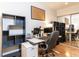 Well-equipped office space with ample storage, computer setup, and natural light at 4521 Briarglen Ln, Holly Springs, NC 27540