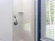 A glass enclosed shower is shown in a bathroom with white tile at 4521 Briarglen Ln, Holly Springs, NC 27540