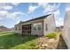 Exterior view of backyard featuring a screen porch at 46 S Great White Way, Clayton, NC 27527