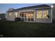 View of backyard with privacy fence, screen porch, and outdoor grill at 46 S Great White Way, Clayton, NC 27527