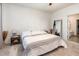 Cozy bedroom with neutral tones, a comfortable bed, and a stylish mirror, creating a serene retreat at 46 S Great White Way, Clayton, NC 27527