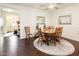 Cozy dining area with a wooden table set and decorative rug, perfect for Gathering meals at 46 S Great White Way, Clayton, NC 27527