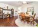 Open concept living and dining area features a wooden table set and decorative accents for modern comfort at 46 S Great White Way, Clayton, NC 27527