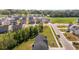 Expansive aerial view of a residential neighborhood, showcasing lush green spaces and well-maintained homes at 473 Lavatera Dr, Wendell, NC 27591
