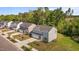 Aerial view of a neighborhood of modern homes, showcasing manicured lawns and tree-lined streets at 473 Lavatera Dr, Wendell, NC 27591