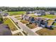 Community street view of well-maintained homes with lush lawns and tree-lined streets in a suburban neighborhood at 473 Lavatera Dr, Wendell, NC 27591