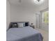 Cozy bedroom includes a plush bed, and a nightstand, and is lit by a ceiling fan at 473 Lavatera Dr, Wendell, NC 27591