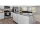 Modern kitchen with granite countertops, stainless steel appliances, and a central island at 473 Lavatera Dr, Wendell, NC 27591