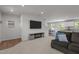 View of the light and airy living room with stylish furnishings, open floor plan, and modern decor at 473 Lavatera Dr, Wendell, NC 27591
