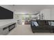 View of the open living space featuring plush seating, kitchen access, and dining area at 473 Lavatera Dr, Wendell, NC 27591