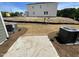 Spacious backyard showing a concrete patio area and newly planted grass at 503 Eastwood St, Durham, NC 27703