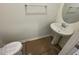 Compact powder room with a pedestal sink and chrome fixtures at 503 Eastwood St, Durham, NC 27703