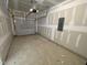 Unfinished one-car garage with concrete floor and primed walls at 503 Eastwood St, Durham, NC 27703