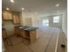Open-concept kitchen with light wood cabinetry flows into the expansive living area at 503 Eastwood St, Durham, NC 27703