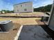 New construction backyard features fresh sod, a concrete patio, and two AC units at 505 Eastwood St, Durham, NC 27704