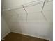 Empty walk-in closet with a wire shelf and white walls, ready for customization and organization at 505 Eastwood St, Durham, NC 27704