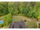 Aerial view showcasing backyard with mature trees at 5209 Thistleby Rd, Fuquay Varina, NC 27526