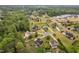 An aerial view shows the neighborhood layout with mature trees, green lawns, and well-spaced homes at 5209 Thistleby Rd, Fuquay Varina, NC 27526