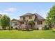 Picturesque backyard with a well-manicured lawn and mature trees at 5209 Thistleby Rd, Fuquay Varina, NC 27526