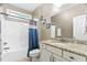 Bathroom showcasing a shower-tub combo with granite counters and modern fixtures at 5209 Thistleby Rd, Fuquay Varina, NC 27526