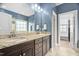 Elegant bathroom with double vanity, granite countertop, and a separate room for the toilet at 5209 Thistleby Rd, Fuquay Varina, NC 27526