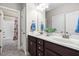 Bathroom with double sink vanity, generous counter space, and tiled floors at 5209 Thistleby Rd, Fuquay Varina, NC 27526