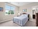 Well-lit bedroom offering a tranquil space with ample natural light and simple décor at 5209 Thistleby Rd, Fuquay Varina, NC 27526