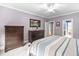 Bedroom with neutral walls, ceiling fan, and furnishings, offering a bright and airy ambiance at 5209 Thistleby Rd, Fuquay Varina, NC 27526