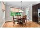 Cozy breakfast nook with natural light, wood floors, and a view of the outdoors at 5209 Thistleby Rd, Fuquay Varina, NC 27526