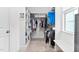 Walk-in closet with custom shelving and hanging racks for organized storage of clothes and accessories at 5209 Thistleby Rd, Fuquay Varina, NC 27526
