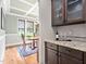 Dining area that features hardwood floors, natural lighting, and a dry bar in the background at 5209 Thistleby Rd, Fuquay Varina, NC 27526