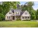 Charming home featuring manicured lawn and stone accents enhance curb appeal at 5209 Thistleby Rd, Fuquay Varina, NC 27526
