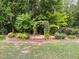 Beautifully landscaped garden path with lush greenery at 5209 Thistleby Rd, Fuquay Varina, NC 27526